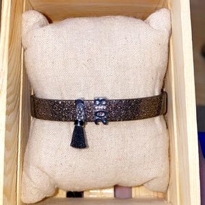 Metallic single black band with two charms